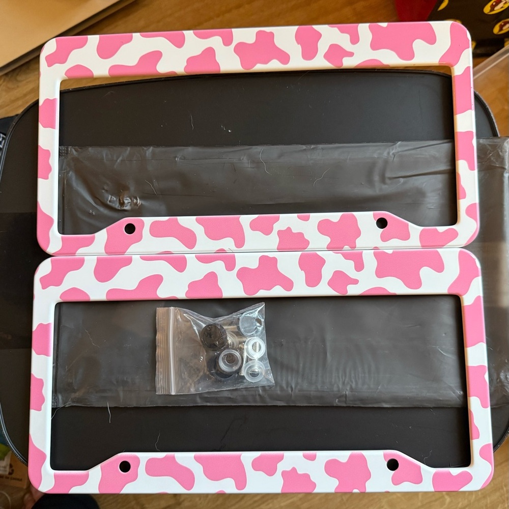 New in package Pink and White Cow Print Metal License Plate Frames 3 available